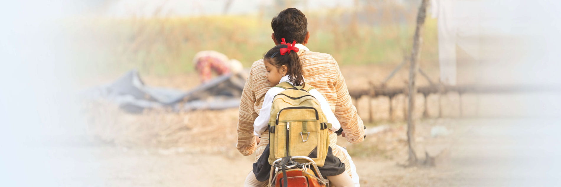 Man with daughter on the motorcycle